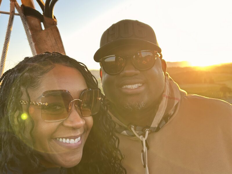 A couple's sunrise selfie aboard their private flight